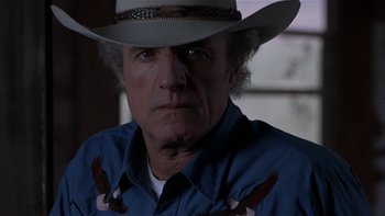 Movie still from “Flesh and Bone” (1993), directed by Steve Kloves – A person wearing a cowboy hat; Close Up shot, Low angle
