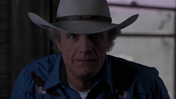 Movie still from “Flesh and Bone” (1993), directed by Steve Kloves – A person wearing a cowboy hat; Close Up shot, Low angle