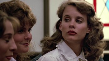 Movie still from “Footloose” (1984), directed by Herbert Ross – Two women are looking at each other in a room; Close Up shot, Over the shoulder angle
