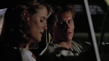 Movie still from “Footloose” (1984), directed by Herbert Ross – A man and a woman sitting in the back of a car; Close Up shot, Over the shoulder angle