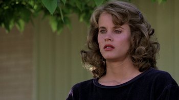 Movie still from “Footloose” (1984), directed by Herbert Ross – A person wearing a black shirt; Close Up shot, Over the shoulder angle