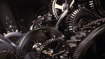 Movie still from “For Colored Girls” (2010), directed by Tyler Perry – View of a bunch of metal gears and cogs; Extreme Close Up shot, Overhead angle