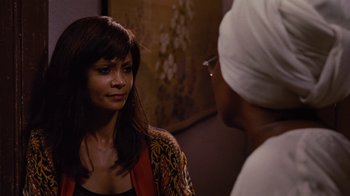 Movie still from “For Colored Girls” (2010), directed by Tyler Perry – A woman talking to another woman in front of a painting; Close Up shot, Over the shoulder angle
