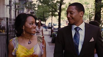Movie still from “For Colored Girls” (2010), directed by Tyler Perry – A man and a woman standing next to each other on a sidewalk; Medium shot, Over the shoulder angle