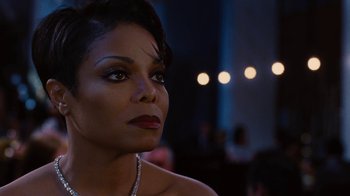 Movie still from “For Colored Girls” (2010), directed by Tyler Perry – A person wearing a necklace; Close Up shot, Over the shoulder angle