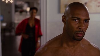 Movie still from “For Colored Girls” (2010), directed by Tyler Perry – A man with a beard is looking at the camera; Close Up shot, Over the shoulder angle