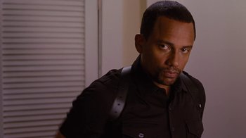 Movie still from “For Colored Girls” (2010), directed by Tyler Perry – A person wearing a black shirt; Close Up shot, Low angle