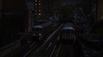 Movie still from “For Colored Girls” (2010), directed by Tyler Perry – Two trains are on the tracks in the dark; Extreme Wide shot, High angle