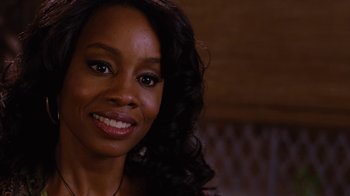 Movie still from “For Colored Girls” (2010), directed by Tyler Perry – A person with long black curly hair; Close Up shot, Over the shoulder angle