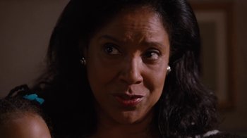 Movie still from “For Colored Girls” (2010), directed by Tyler Perry – A woman's face with her mouth wide open; Close Up shot, Over the shoulder angle