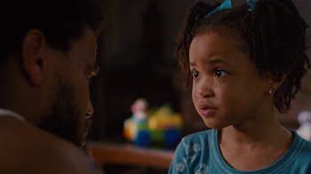 Movie still from “For Colored Girls” (2010), directed by Tyler Perry – A little girl and a man are looking at each other; Close Up shot, Over the shoulder angle