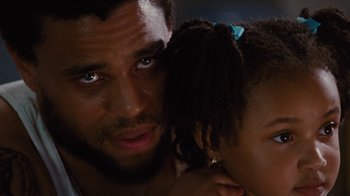 Movie still from “For Colored Girls” (2010), directed by Tyler Perry – A person and a child; Close Up shot, Low angle