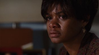 Movie still from “For Colored Girls” (2010), directed by Tyler Perry – A person looking at the camera; Close Up shot, Over the shoulder angle