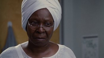 Movie still from “For Colored Girls” (2010), directed by Tyler Perry – An older woman wearing a head wrap and glasses; Close Up shot, Over the shoulder angle