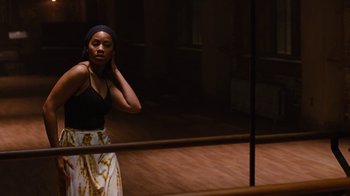 Movie still from “For Colored Girls” (2010), directed by Tyler Perry – A woman standing in front of a mirror in a room; Medium shot, Low angle