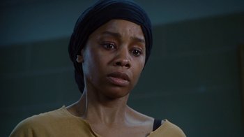 Movie still from “For Colored Girls” (2010), directed by Tyler Perry – A person wearing a head scarf; Close Up shot, Low angle