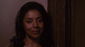Movie still from “For Colored Girls” (2010), directed by Tyler Perry – A person with long black hair; Close Up shot, Low angle