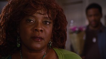 Movie still from “For Colored Girls” (2010), directed by Tyler Perry – A person wearing a green shirt; Close Up shot, Low angle