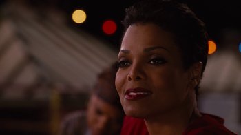 Movie still from “For Colored Girls” (2010), directed by Tyler Perry – A person with short black hair; Close Up shot, Over the shoulder angle