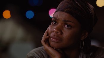 Movie still from “For Colored Girls” (2010), directed by Tyler Perry – A person with her hand on her chin; Close Up shot, Over the shoulder angle