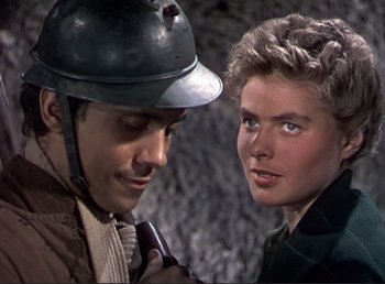 Movie still from “For Whom the Bell Tolls” (1943), directed by Sam Wood – A man and a woman looking at one another; Close Up shot, Over the shoulder angle
