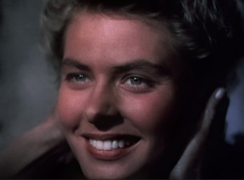 Movie still from “For Whom the Bell Tolls” (1943), directed by Sam Wood – A woman's face with green eyes; Close Up shot, High angle