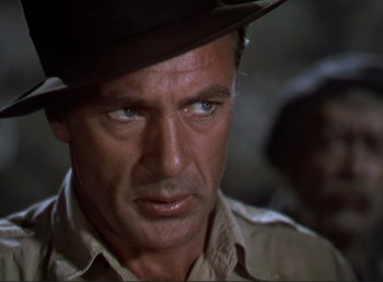 Movie still from “For Whom the Bell Tolls” (1943), directed by Sam Wood – A person wearing a hat; Close Up shot, Low angle