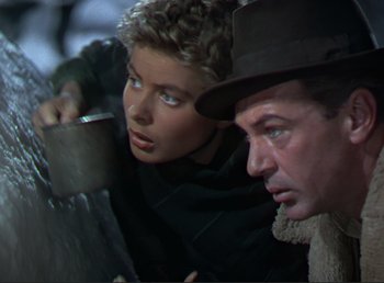 Movie still from “For Whom the Bell Tolls” (1943), directed by Sam Wood – A man and a woman looking at each other; Close Up shot, Low angle