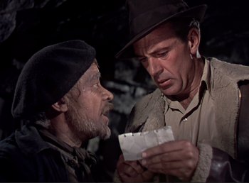 Movie still from “For Whom the Bell Tolls” (1943), directed by Sam Wood – Two men are looking at a piece of paper together; Close Up shot, Over the shoulder angle