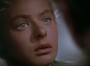 Movie still from “For Whom the Bell Tolls” (1943), directed by Sam Wood – A woman's face with green eyes; Close Up shot, Over the shoulder angle