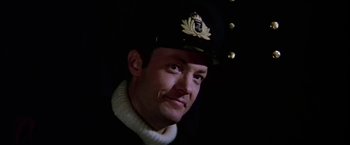 Movie still from “Force 10 from Navarone” (1978), directed by Guy Hamilton – A person wearing a hat; Close Up shot, Low angle