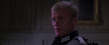 Movie still from “Force 10 from Navarone” (1978), directed by Guy Hamilton – A person wearing a uniform; Close Up shot, Over the shoulder angle