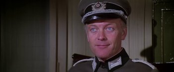 Movie still from “Force 10 from Navarone” (1978), directed by Guy Hamilton – A person wearing a uniform; Close Up shot, Low angle