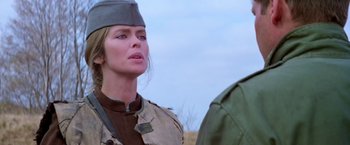 Movie still from “Force 10 from Navarone” (1978), directed by Guy Hamilton – A woman in a military uniform looking at a man in fatigues; Close Up shot, Over the shoulder angle