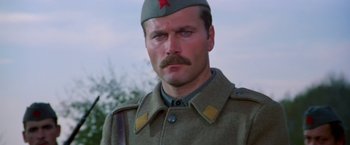 Movie still from “Force 10 from Navarone” (1978), directed by Guy Hamilton – A person wearing a military uniform; Close Up shot, Low angle