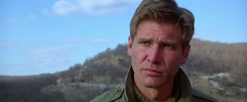 Movie still from “Force 10 from Navarone” (1978), directed by Guy Hamilton – A person wearing a jacket; Close Up shot, Low angle