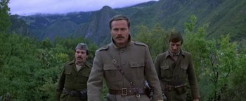 Movie still from “Force 10 from Navarone” (1978), directed by Guy Hamilton – A group of men standing next to each other in uniform; Medium shot, Low angle