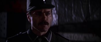 Movie still from “Force 10 from Navarone” (1978), directed by Guy Hamilton – A person wearing a uniform; Close Up shot, Low angle