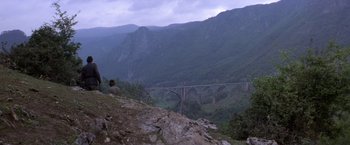 Movie still from “Force 10 from Navarone” (1978), directed by Guy Hamilton – A view of a bridge that is in the middle of a valley; Extreme Wide shot, High angle