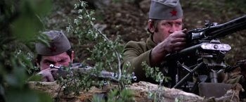 Movie still from “Force 10 from Navarone” (1978), directed by Guy Hamilton – A man with a rifle in his hand and a red star on his hat; Close Up shot, Low angle