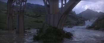 Movie still from “Force 10 from Navarone” (1978), directed by Guy Hamilton – A view of a bridge that has been destroyed; Extreme Wide shot, High angle