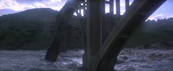 Movie still from “Force 10 from Navarone” (1978), directed by Guy Hamilton – A view of a bridge that is in the middle of a river; Extreme Wide shot, High angle