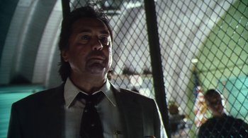 Movie still from “Forces of Nature” (1999), directed by Bronwen Hughes – A person wearing a suit and a tie; Close Up shot, Low angle