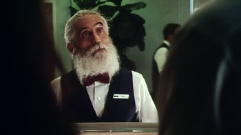 Movie still from “Forces of Nature” (1999), directed by Bronwen Hughes – An old man with a long white beard looking into a mirror; Close Up shot, Low angle