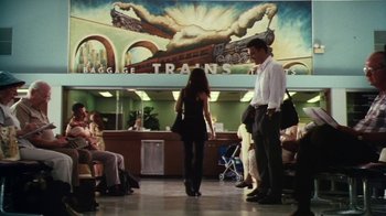 Movie still from “Forces of Nature” (1999), directed by Bronwen Hughes – A man and a woman are walking in a train station; Wide shot, Low angle