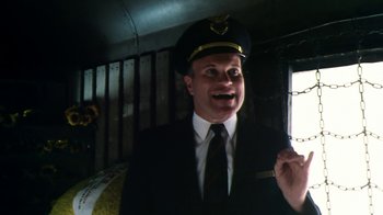 Movie still from “Forces of Nature” (1999), directed by Bronwen Hughes – A man wearing a hat and a uniform; Medium shot, Low angle