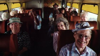 Movie still from “Forces of Nature” (1999), directed by Bronwen Hughes – A group of people riding on a bus; Wide shot, High angle