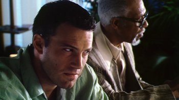 Movie still from “Forces of Nature” (1999), directed by Bronwen Hughes – A man in a green shirt and a man in a brown shirt; Close Up shot, Low angle