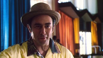 Movie still from “Forces of Nature” (1999), directed by Bronwen Hughes – A person wearing a straw hat; Close Up shot, Low angle