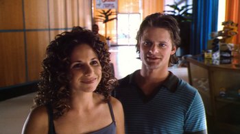 Movie still from “Forces of Nature” (1999), directed by Bronwen Hughes – A man and a woman posing for a picture; Close Up shot, Over the shoulder angle